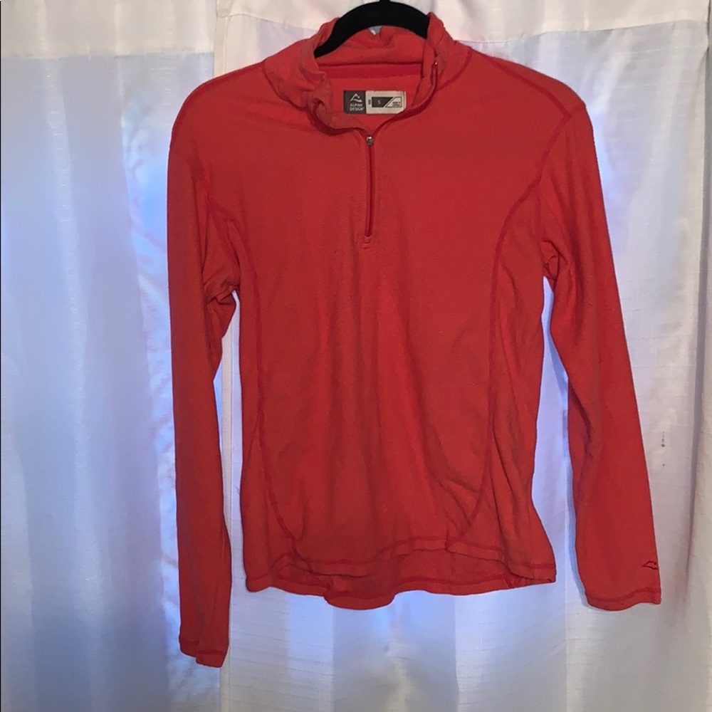 Pink long sleeve quarter zip jacket.